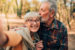 older couple kissing and taking a selfie